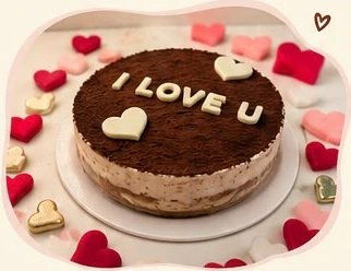 Round tiramisu cake decorated with hearts
